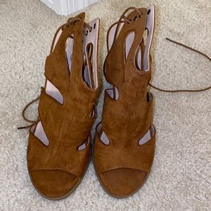 Brown cutout heels with lace up back